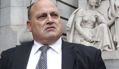 FILE - In this Nov. 1, 2013 file photo, Ralph M. Mariano exits federal court in Providence, R.I., after being sentenced to 10 years in prison in a Navy kickback scheme. Mariano has asked the 1st U.S. Circuit Court of Appeals to throw out his sentence. In a court filing Thursday, May 22, 2014, the government argues Mariano is not entitled to a more lenient sentence because after he pleaded guilty, he claimed the crimes never happened. It also says he waived his right to appeal.  (AP Photo/Stew Milne, File)