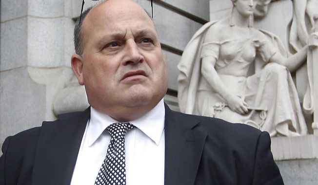 FILE - In this Nov. 1, 2013 file photo, Ralph M. Mariano exits federal court in Providence, R.I., after being sentenced to 10 years in prison in a Navy kickback scheme. Mariano has asked the 1st U.S. Circuit Court of Appeals to throw out his sentence. In a court filing Thursday, May 22, 2014, the government argues Mariano is not entitled to a more lenient sentence because after he pleaded guilty, he claimed the crimes never happened. It also says he waived his right to appeal.  (AP Photo/Stew Milne, File)