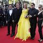 From right, Kelly Preston, John Travolta, Uma Thurman, director Quentin Tarantino and producer Laurence Bender arrive for the screening of Sils Maria at the 67th international film festival, Cannes, southern France, Friday, May 23, 2014. (AP Photo/Alastair Grant)
