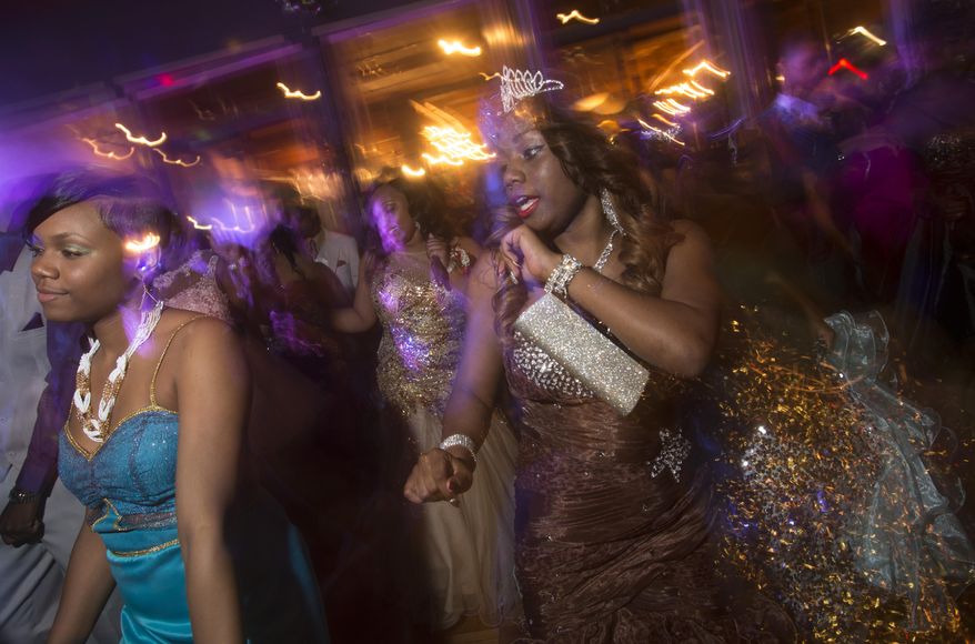 Brandi Barnett dances during the Saginaw High School prom, Thursday, May 22, 2014 at the Candlelite Banquet Center in Bridgeport Township. (AP Photo/The Saginaw News, Tim Goessman)