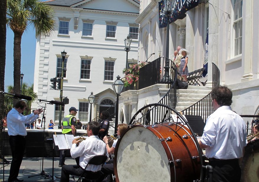 Musicians perform a brass fanfare during the opening ceremonies of the Spoleto Festival USA on Friday, May 23, 2014, in Charleston, S.C. The 2014 edition of the internationally known arts festival continues through June 8 featuring 148 performances by 63 artists and ensembles. (AP Photo/Bruce Smith)