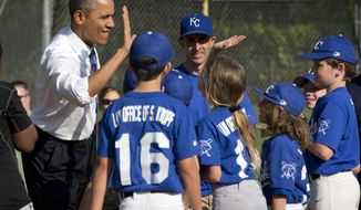 In this May 19, 2014, photo, President Barack Obama greets players as he makes an unannounced stop to surprise members of the Northwest little league baseball teams at Friendship Park in Washington.  Obama seems to have caught a bad case of cabin fever. Since taking office, Obama has periodically grumbled about the claustrophobia that sets in when his every move is surrounded by intense security, rendering it nearly impossible to enjoy the simple pleasures that private citizens take for granted. But in recent days, the president has made more of a point to get out.  (AP Photo/Pablo Martinez Monsivais)