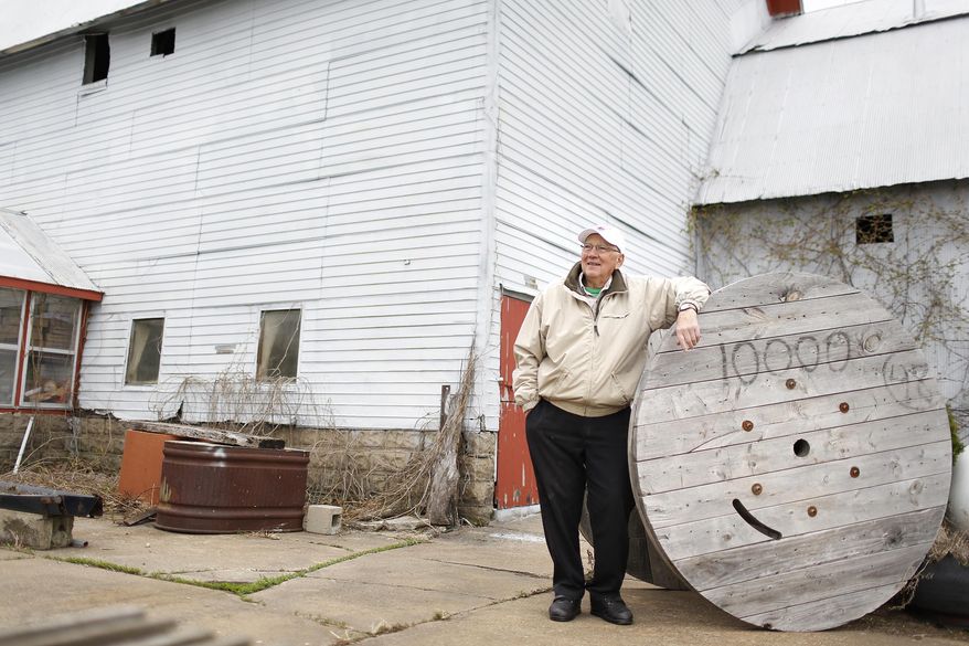 In a Friday, May 9, 2014 photo, Robert Jefferson, 86, stands on his Heritage Farm in Dunkerton, Iowa. Jefferson's Heritage Farm is 158 years old, and one of only 10 in Black Hawk County that have earned the Heritage designation from the Iowa Department of Agriculture and Land Stewardship. (AP Photo/Waterloo Courier, Matthew Putney)