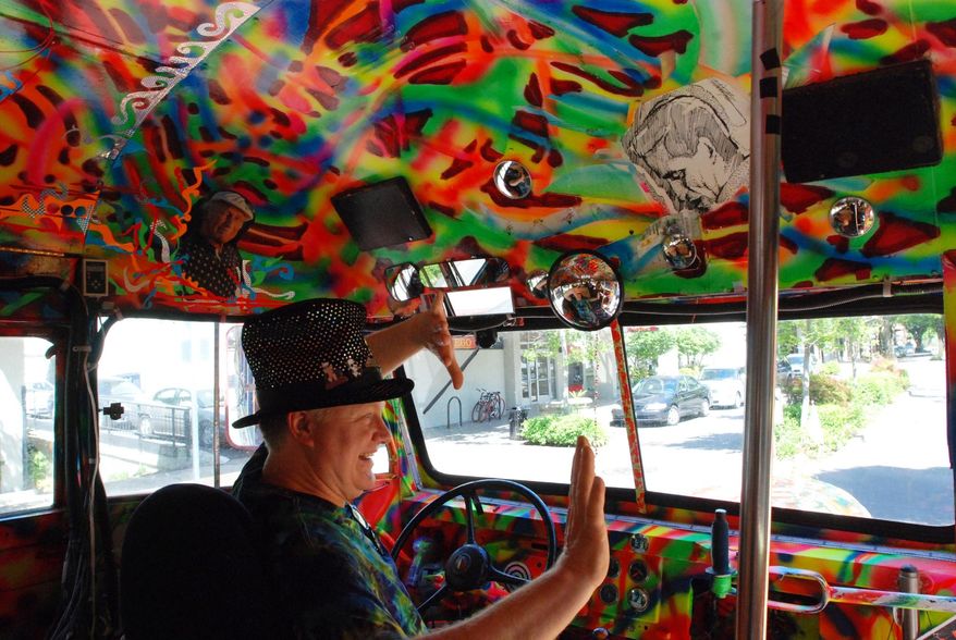 Zane Kesey waves goodbye in Eugene, Ore., after dropping off riders on the latest version of the bus Further. Kesey is on Kickstarter raising money for a 50th anniversary commemoratioin of the 1964 bus trip across America by his father, the late author Ken Kesey, and his friends, the Merry Pranksters. This time there will be no LSD. Investors get to ride along and take part in a new movie of the trip. (AP Photo/Jeff Barnard)