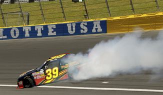 Ryan Sieg (39) spins out of control after driving through turn two during the NASCAR Nationwide series History 300 auto race at Charlotte Motor Speedway in Concord, N.C., Saturday, May 24, 2014. (AP Photo/Chris Keane)