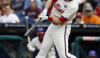 Philadelphia Phillies&#39; Chase Utley hits a two-run home run off Los Angeles Dodgers starting pitcher Dan Haren during the first inning of a baseball game, Saturday, May 24, 2014, in Philadelphia. (AP Photo/Matt Slocum)