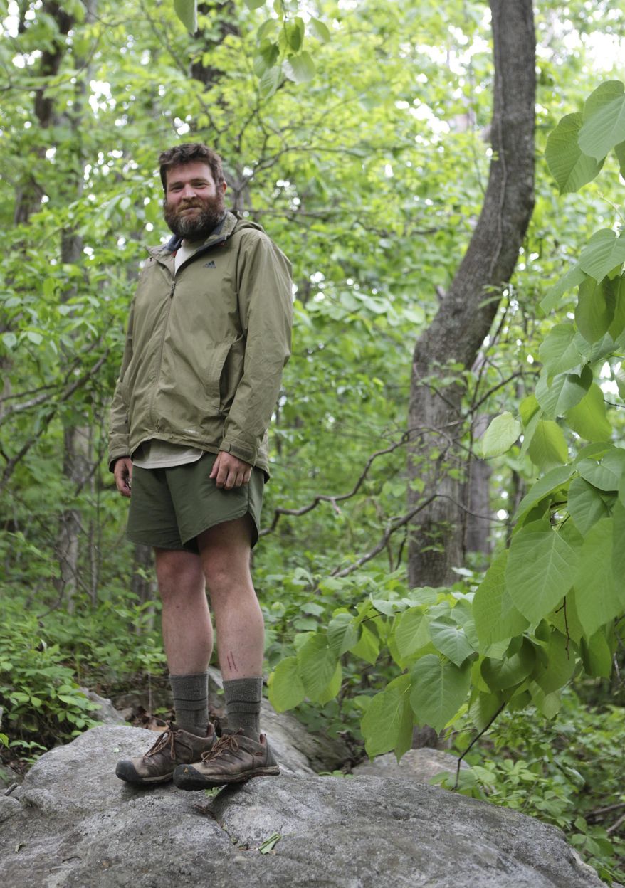 Todd Rogers poses for a portrait on Catawba Mountain after completing six miles on May 17, 2014. Sean Gobin founded the Warrior Hike to coordinate hikes for other veterans who are struggling to adapt to civilian life. This spring, 26 veterans set off on hikes along the AT, the Continental Divide Trail and the Pacific Crest Trail. (AP Photo/The Roanoke Times, Erica Yoon) LOCAL TV OUT; SALEM TIMES REGISTER OUT; FINCASTLE HERALD OUT; CHRISTIANBURG NEWS MESSENGER OUT; RADFORD NEWS JOURNAL OUT; ROANOKE STAR SENTINEL OUT
