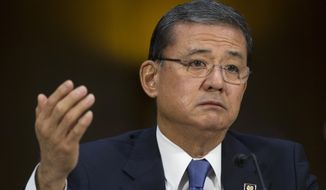 ** FILE ** This May 15, 2014, file photo shows Veterans Affairs Secretary Eric Shinseki testifying on Capitol Hill in Washington. The Department of Veterans Affairs says it will allow more veterans to obtain health care at private hospitals and clinics. Shinseki announced the change Saturday. (AP Photo/Cliff Owen, File)