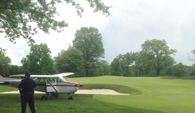 In this Saturday, May 24, 2014 photograph provided by Stephen P Wolsky, a small airplane rests on a fairway after making an emergency landing at Mountain Ridge Country Club in West Caldwell, N.J. Authorities say no injuries were reported. (AP Photo/Stephen P. Wolsky)