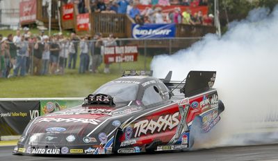 Courtney Force joins her sister Brittany as one of the top qualifiers at the NHRA Kansas Nationals drag races at Heartland Park in Topeka, Kan., Saturday, May 24, 2015. (AP Photo/Topeka Capital-Journal, Chris Neal)