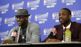 Miami Heat guard Dwyane Wade, right, and forward LeBron James speak during a news conference following Game 3 in the NBA basketball Eastern Conference finals playoff series against the Indiana Pacesr, Saturday, May 24, 2014, in Miami. The Heat defeated the Pacers 99-87. (AP Photo/Lynne Sladky)