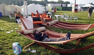 Mary Milz, of Indianapolis, lies in a hammock, in the &amp;quot;Glamping&amp;quot; area in the infield at the Indianapolis Motor Speedway before the start of Indianapolis 500 IndyCar auto race in Indianapolis, Sunday, May 25, 2014. The 98th running of the Indianapolis 500 was Sunday. (AP Photo/Tom Strattman)