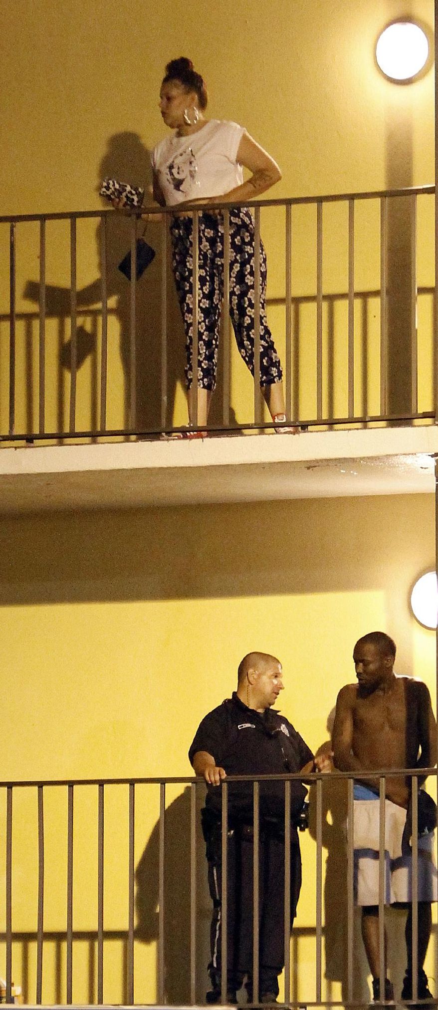 Myrtle Beach Police talk to guests at Bermuda Sands Resort late Saturday, May 24, 2014. Police report three people were killed and one was injured late Saturday. (AP Photo/The Sun News, Janet Blackmon Morgan)