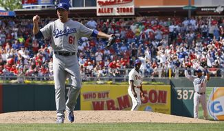 Los Angeles Dodgers starting pitcher Josh Beckett reacts after striking out Philadelphia Phillies&#39; Chase Utley looking for a no-hitter baseball game, Sunday, May 25, 2014, in Philadelphia. Los Angeles won 6-0. (AP Photo/Matt Slocum)