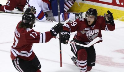 Guelph Storm Stephen Pietog (right) celebrates his goal with Tyler Bertuzzi, Edmonton Oil Kings during first period action in the Final Championship game of the Memorial Cup CHL hockey tournament, in London, Ontario, Sunday, May 25, 2014. (AP Photo/The Canadian Press, Dave Chidley)