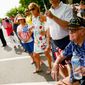 Retired Army Seaman Charles Wilson of Providence, R.I. (above), who landed in Guam during WWII, joins other visitors along Constitution Avenue to watch the National Memorial Day Parade on Monday.