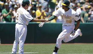 CORRECTS DATE TO 26 -Oakland Athletics&#39; Kyle Blanks, right, is congratulated by third base coach Mike Gallego (2) after hitting a home run off Detroit Tigers&#39; Drew Smyly  in the second inning of a baseball game Monday, May 26, 2014, in Oakland, Calif. (AP Photo/Ben Margot)