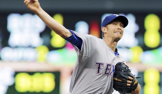 Texas Rangers pitcher Scott Baker throws against the Minnesota Twins in the first inning of a baseball game Tuesday, May 27, 2014, in Minneapolis. (AP Photo/Jim Mone)
