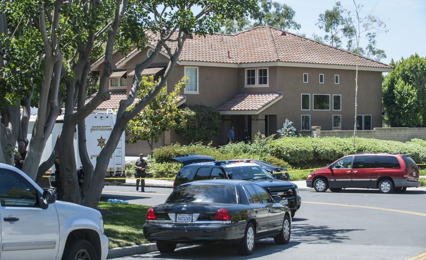 The Orange County Sheriff's Department investigate a scene where four bodies were found in this home on 25601 Pacific Hills Drive in Mission Viejo Tuesday morning, May 27, 2014. The bodies were found by Orange County deputies making a welfare check after a relative's emergency call, sheriff's Lt. Jeff Hallock said. (AP Photo/The Orange County Register, Mark Rightmire) MAGS OUT; LOS ANGELES TIMES OUT ///ADDITIONAL INFORMATION: 4dead – 5/27/14 – MARK RIGHTMIRE, ORANGE COUNTY REGISTER -