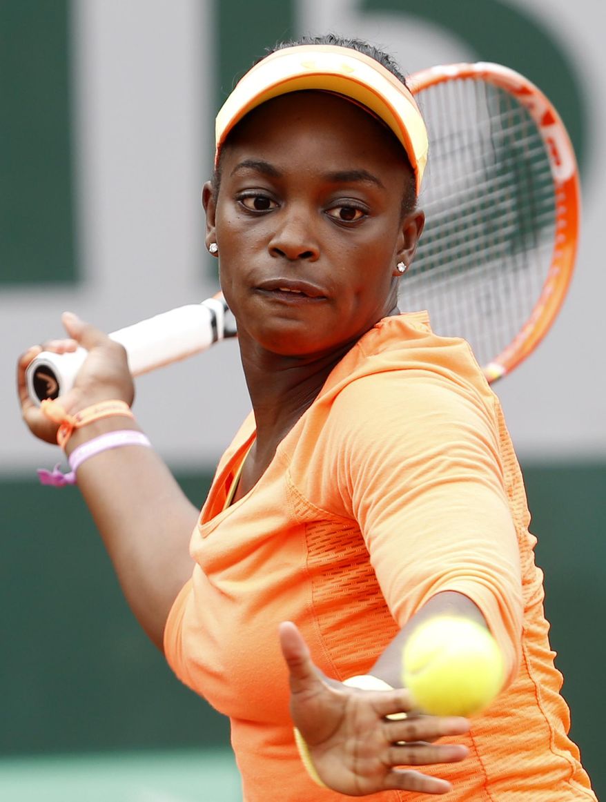 Sloane Stephens, of the U.S, returns the ball to China&#39;s Peng Shuai during the first round match of  the French Open tennis tournament at the Roland Garros stadium, in Paris, France, Tuesday, May 27, 2014. (AP Photo/Darko Vojinovic)