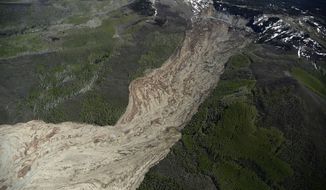 The aftermath of the Mesa County Mudslide is photographed from a plane, Monday, May 26, 2014, near Collbran, Colo. Rescue teams are searching for three men missing after a half-mile stretch of a ridge saturated with rain collapsed. (AP Photo/The Denver Post, AAron Ontiveroz) MAGS OUT; TV OUT; INTERNET OUT; NO SALES; NEW YORK POST OUT; NEW YORK DAILY NEWS OUT