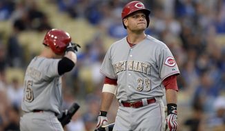 Cincinnati Reds Devin Mesoraco reacts after striking out in the eighth inning of a baseball game against the Los Angeles Dodgers, Monday, May 26, 2014, in Los Angeles. The Dodgers won 4-3. (AP Photo/Gus Ruelas)