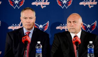 Washington Capitals owner Ted Leonsis and president Dick Patrick introduce new general manager Brian MacLellan, left, and head coach Barry Trotz, right, to the media at a press conference at the Verizon Center, Washington, D.C., Tuesday, May 27, 2014. (Andrew Harnik/The Washington Times)