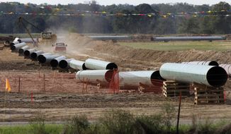In this Oct. 4, 2012 file photo, large sections of pipe are shown in Sumner Texas. Safety regulators have quietly placed two extra conditions on construction of TransCanada Corp.’s Keystone XL oil pipeline after learning of potentially dangerous construction defects involving the pipeline’s southern leg.  The new conditions were added four months after the pipeline safety agency sent TransCanada two warning letters about defects and other construction problems on the Keystone Gulf Coast Pipeline, which extends from Oklahoma to the Texas Gulf Coast. (AP Photo/Tony Gutierrez, file)