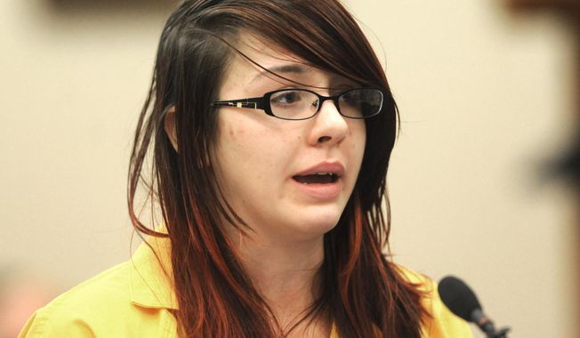 Samantha Grigg addresses the court in Clinton County Circuit Court Tuesday, May 27, 2014, before being sentence in St. John's Mich. Grigg, an 18-year-old high school senior who drove a vehicle involved in the death Michigan State University student Dustyn Frolka, 19, was sentenced Tuesday to 6 to 15 years in prison for manslaughter and unarmed robbery. (AP Photo/The State Journal, Greg DeRuiter)  NO SALES