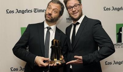 Judd Apatow, left, recipient of the Hollywood Comedy Award, poses with actor Seth Rogen backstage at the 16th Annual Hollywood Film Awards Gala on Monday, Oct. 22, 2012, in Beverly Hills, Calif. (Photo by Chris Pizzello/Invision/AP)