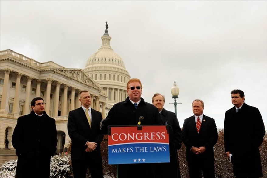 Larry Kawa (foreground) outside the U.S. Capitol in February explaining the next move in his Constitutional challenge to Obamacare.