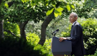 President Barack Obama speaks about the future of US troops in Afghanistan, Tuesday, May 27, 2014, in the Rose Garden of the White House in Washington. The president will seek to keep 9,800 US troops in Afghanistan after the war formally ends later this year and then will withdraw most of those forces by the end of 2016.  (AP Photo/Susan Walsh)