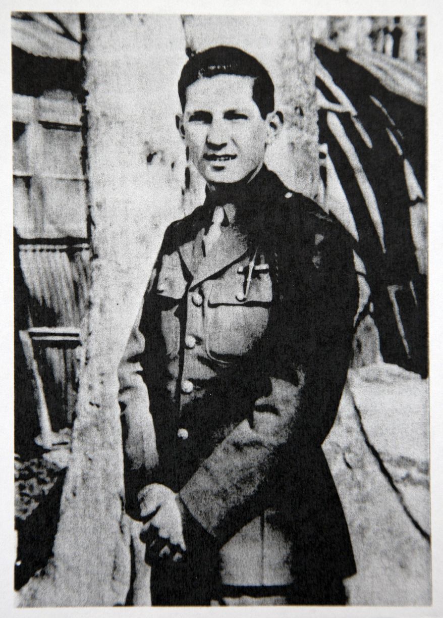 ADVANCE FOR USE MONDAY, JUNE 2, 2014, AND THEREAFTER - In this April 1944 photo provided by Richard Crum, of Williamston, Mich., Pfc. Richard Crum stands for a photo when he was 20 years old in Blandford, England. Crum landed on Omaha Beach on D-Day, June 6, 1944. (AP Photo/Richard Crum)