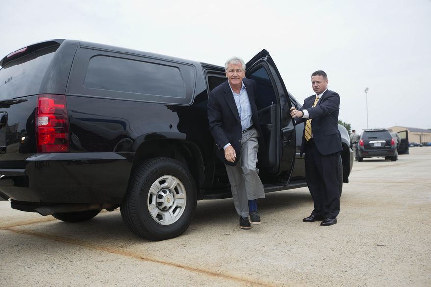 Defense Secretary Chuck Hagel steps out of his vehicle before boarding his plane prior to his departure from Andrews Air Force Base, Md., Wednesday, May 28, 2014. Hagel is traveling on a 12-day trip to Asia and Europe, his fourteenth international trip, to discuss key regional and global issues with leaders of several countries. (AP Photo/Pablo Martinez, Pool)