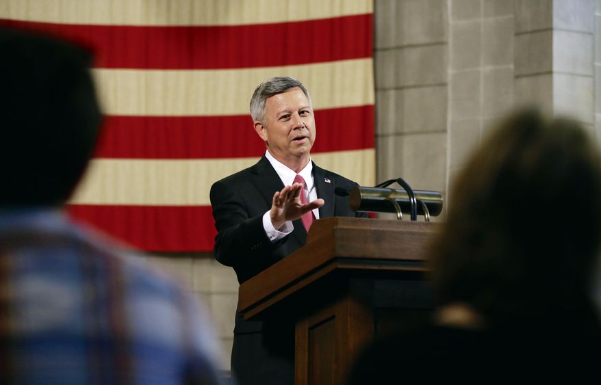 Nebraska Gov. Dave Heineman speaks at a news conference in Omaha, Neb., Wednesday, May 28, 2014. Gov. Heineman announced he had applied for the University of Nebraska presidency, little more than a week after he publicly expressed interest in the job. The presidency came open with the departure of J.B. Milliken, who became chancellor of the City University of New York. (AP Photo/Nati Harnik)