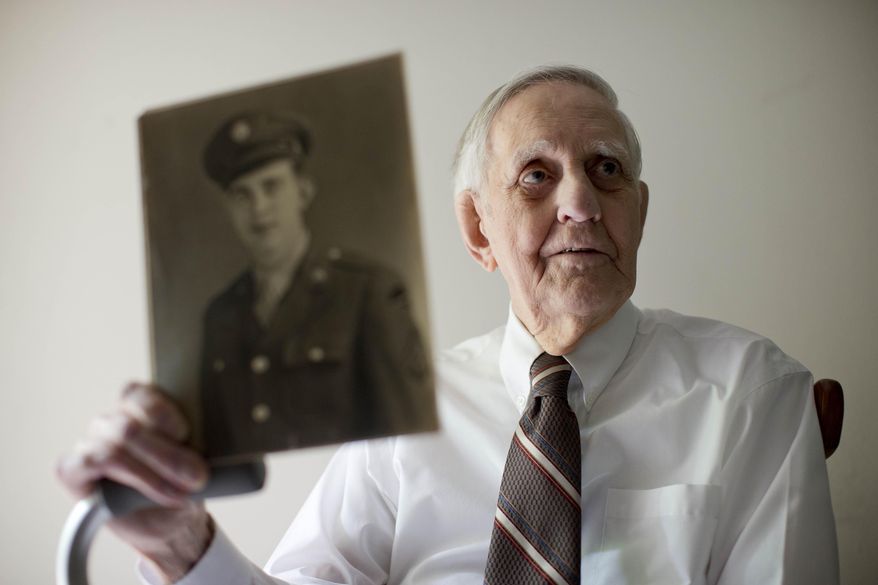 ADVANCE FOR USE SUNDAY, JUNE 1, 2014, AND THEREAFTER - In this May 27, 2014 photo, World War II veteran Richard “Bert” King, 89, poses for a portrait at his home in Ambler, Pa. King took part in the D-Day invasion on June 6, 1944. When he was reminded about the upcoming 70th anniversary of D-Day, he quipped, “Geez, I’m getting old.” (AP Photo/Matt Rourke)