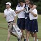 Dallas Cowboys linebacker Sean Lee is helped off the field by head athletic trainer Jim Maurer, left rear, and associate athletic trainer Britt Brown, right, after suffering an unknown left knee injury during an NFL football organized team activity, Tuesday, May 27, 2014, in Irving, Texas. (AP Photo/Tony Gutierrez)