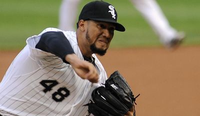 Chicago White Sox starting pitcher Hector Noesi throws against the Cleveland Indians during the first inning of a baseball game in Chicago on Wednesday, May 28, 2014. (AP Photo/ Matt Marton)