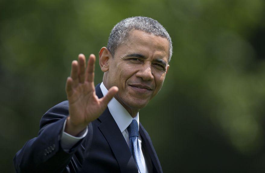 President Barack Obama waves as he walks from the Marine One helicopter to the Oval Office of the White House, in Washington,  Wednesday, May 28, 2014, as he returns from delivering the commencement address at the United States Military Academy at West Point, New York. (AP Photo/Carolyn Kaster)