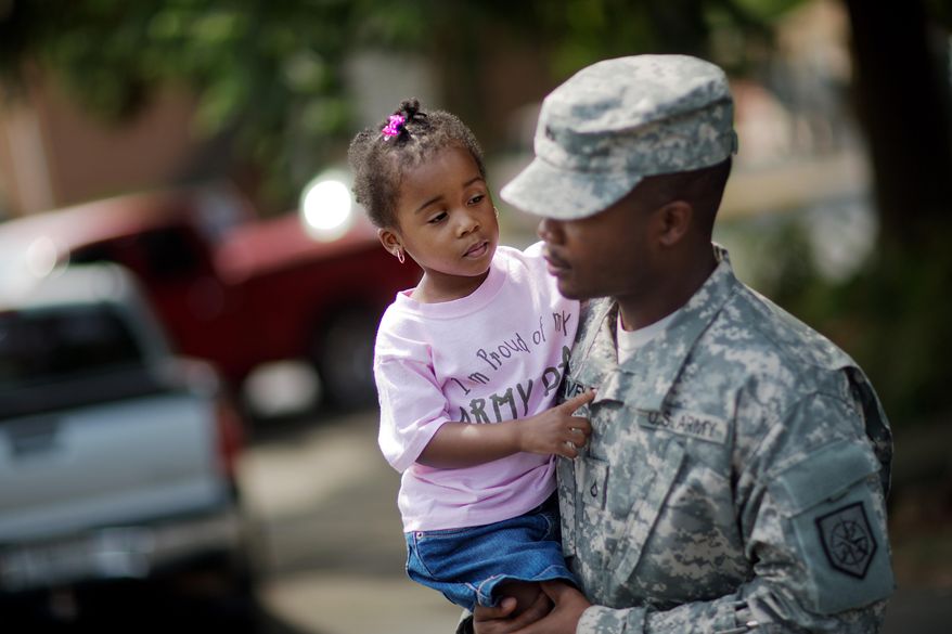 Anslee Harvey, 3, is carried by her father Pfc. Michael Harvey, of Atlanta, with the Georgia National Guard 876th Vertical EN Company, as they leave a departure ceremony before the unit deploys to Afghanistan, Thursday, May 29, 2014, in Toccoa, Ga. The unit's deployment marks the last for the Georgia Army National Guard to Afghanistan as the military looks to withdrawal all but some 10,000 troops after 2014. Officials say the unit's work overseas will include repair, construction, plumbing and more. Officials say the group from Toccoa will be deployed with nearly 150 guardsmen. (AP Photo/David Goldman)