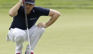 Keegan Bradley lines up his putt on the 18th hole during the first round of the Memorial golf tournament Thursday, May 29, 2014, in Dublin, Ohio. (AP Photo/Jay LaPrete)