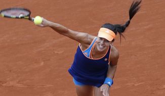 Serbia&#39;s Anna Ivanovic serves the ball during the second round match of the French Open tennis tournament against Ukraine&#39;s Elina Svitolina at the Roland Garros stadium, in Paris, France, Thursday, May 29, 2014. (AP Photo/Darko Vojinovic)