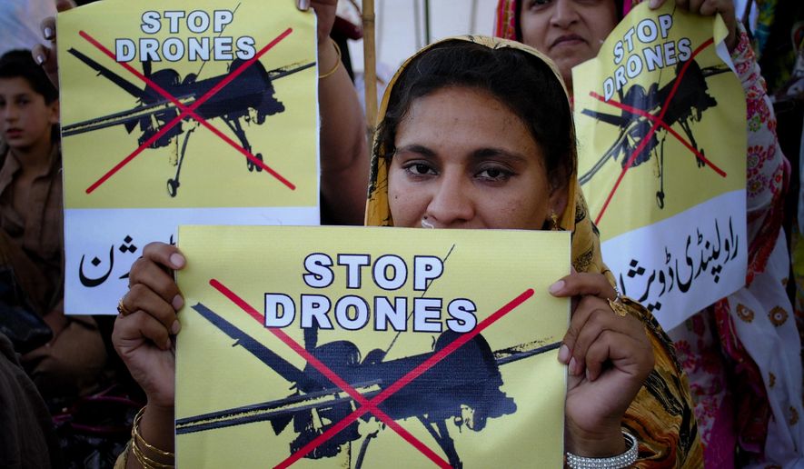 Pakistan women take part in a rally against the U.S. drone strikes in Pakistani tribal areas in Peshawar, Pakistan, in this April 23, 2011, file photo. (AP Photo/Mohammad Sajjad, file)