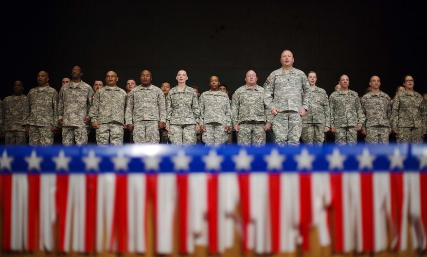 Soldiers with the Georgia National Guard 876th Vertical EN Company stand during a departure ceremony before the unit deploys to Afghanistan, Thursday, May 29, 2014, in Toccoa, Ga. Officials say the group from Toccoa will be deployed with nearly 150 guardsmen. (AP Photo/David Goldman)