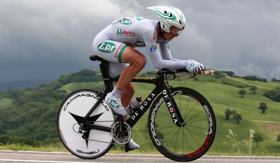 FILE - In this May 20, 2008 file photo, Paolo Savoldelli of Italy pedals during the 10th stage time trial from Pesaro to Urbino, of the Giro d&#x27;Italia cycling race. Retired two-time Giro d&#x27;Italia champion Paolo Savoldelli has been banned for six months for visiting with a banned physician involved in the Lance Armstrong doping scandal. The Italian Olympic Committee&#x27;s anti-doping prosecutor had sought a 28-month ban but the committee&#x27;s in-house doping court decided to drop the harsher penalties of actual doping. Savoldelli won the Giro in 2002 and 2005 and retired in 2008. He recently worked for RAI state TV.  (AP Photo/Alessandro Trovati, file)