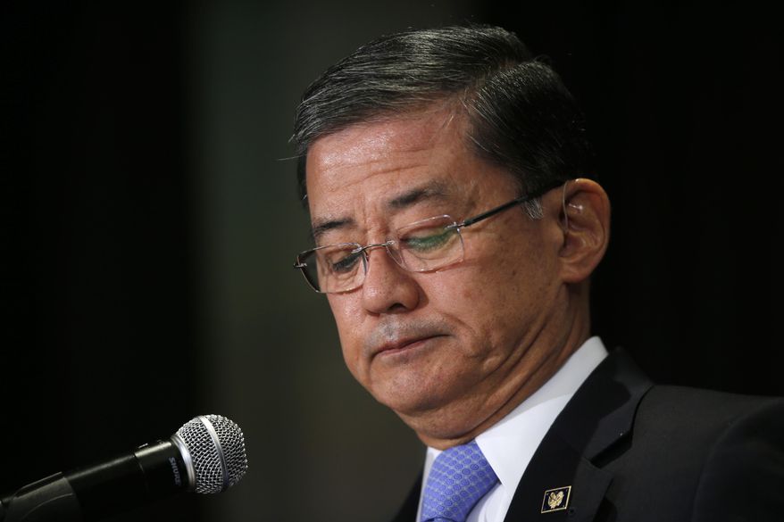 Veterans Affairs Secretary Eric Shinseki pauses as he speaks at a meeting of the National Coalition for Homeless Veterans, Friday, May 30, 2014, in Washington. President Barack Obama says he plans to have a "serious conversation" with Shinseki about whether he can stay in his job. (AP Photo/Charles Dharapak)