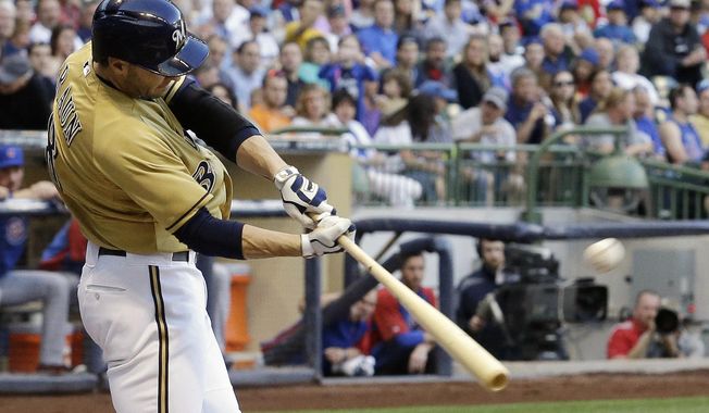 Milwaukee Brewers&#x27; Ryan Braun hits a two-run home run during the first inning of a baseball game against the Chicago Cubs, Friday, May 30, 2014, in Milwaukee. (AP Photo/Morry Gash)