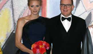 FILE-  In this Saturday, March 29, 2014 file photo, Prince Albert II of Monaco, and his wife Princess Charlene pose for photographers as they arrive at the Rose Ball for the 50th anniversary of the Princess Grace Foundation, in Monaco. Princess Charlene of Monaco, who married Prince Albert II in 2011, has announced she is pregnant with the pair&#39;s first baby. The 36-year-old South African former Olympic swimmer and her husband issued a statement expressing their &amp;quot;immense joy&amp;quot; at the news. The short statement says that the birth is expected before the end of the year, which means the princess is at least three months pregnant. (AP Photo, file)