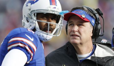 FILE - In this Nov. 17, 2013 file photo, Buffalo Bills head coach Doug Marrone, right, and Buffalo Bills quarterback EJ Manuel talk during the first half of an NFL football game against the New York Jets, in Orchard Park, N.Y.  Leaving the Bills defense to new coordinator Jim Schwartz, Marrone is making the retooled EJ Manuel-led offense his primary focus during the team&#39;s spring minicamp sessions.(AP Photo/Gary Wiepert, File)