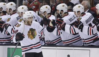 Chicago Blackhawks right wing Patrick Kane celebrates his goal against the Los Angeles Kings during second period of Game 6 of the Western Conference finals of the NHL hockey Stanley Cup playoffs in Los Angeles. Friday, May 30, 2014. (AP Photo/Chris Carlson)